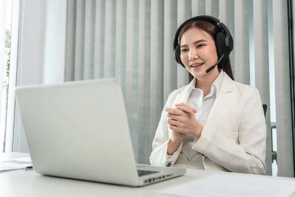 Female call center provides information to a customer calling for help, Contact us, Service with a beautiful and friendly voice, Long distance communication, Talk using headphones or headsets.