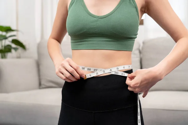 Sporty Woman Sportswear Measuring Waist Circumference Looking Tape Measure Checking — Stockfoto