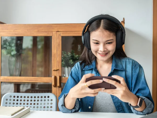 Young Woman Student Headphone Using Smartphone Playing Games Listening Music — Fotografia de Stock