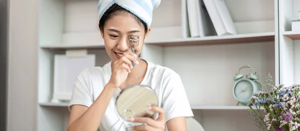 Half Japanese woman putting on makeup and hair to prepare for work in the morning, Facial care and cosmetics, Make up mirror,  Take a shower and put on make-up and get dressed and ready to go to work.