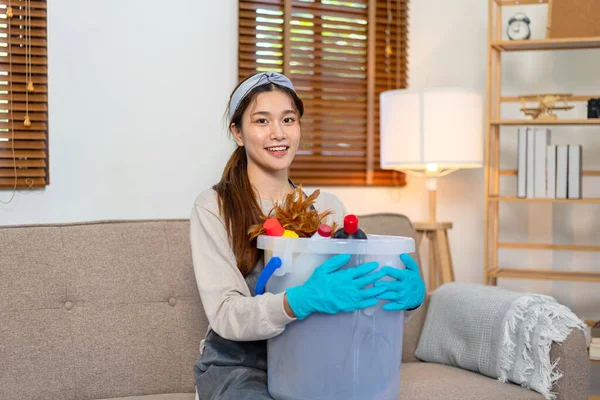 Housekeeper Wearing Protective Gloves Holding Bucket Cleanser Bottle Feather Duster — 图库照片
