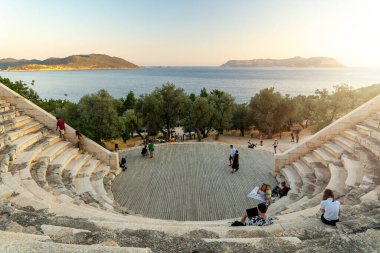 Ka, Antalya  Turkey - 07.02.2022: Night photo of people wandering in ancient amphitheater of Ka.