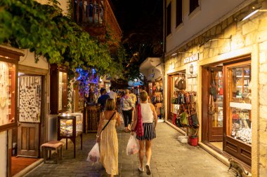 Ka, Antalya  Turkey - 07.02.2022: Night photo of people wandering in narrow streets of Ka.
