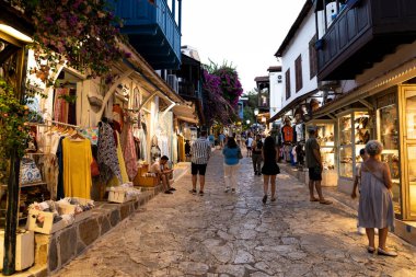 Ka, Antalya  Turkey - 07.02.2022: Night photo of people wandering in narrow streets of Ka.