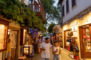 Ka, Antalya  Turkey - 07.02.2022: Night photo of people wandering in narrow streets of Ka.