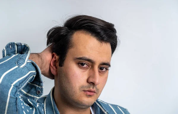 Close up photo of brown skinned man with well groomed hair. Hair care and coiffeur concept.