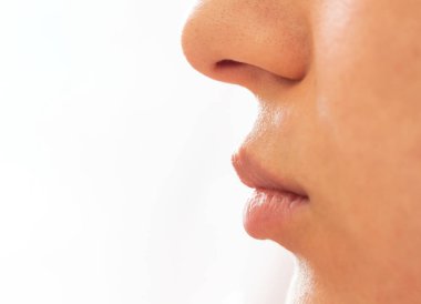 Side view photo of young adult women lips with no makeup. Botox treatment concept.