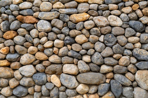 Stacked stones as an decorative object in the yard. background texture or pattern concept.