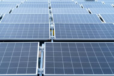 Close up photo of installed solar panels on the roof of building. Clean and green energy concept.