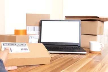 Online shopping boxes and laptop screen mockup. online start up concept