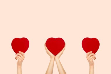 Hands holding heart shaped box with isolated background. charity and donation concept.