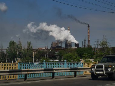 smoke pipe on factory background, industrial landscape.
