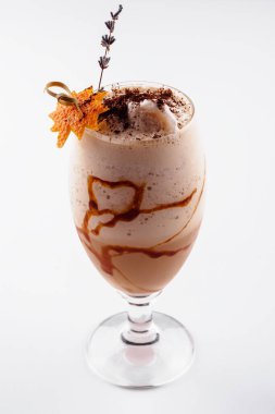 Glasses of coffee cocktail on white background