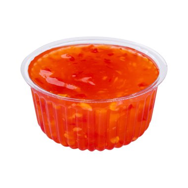 Orange sweet and sour sauce isolated on white