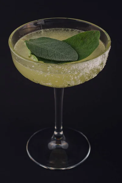 Classic margarita cocktail with mint leaves