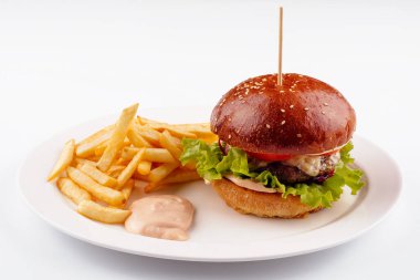 Classic beef burger with cheese and french fries