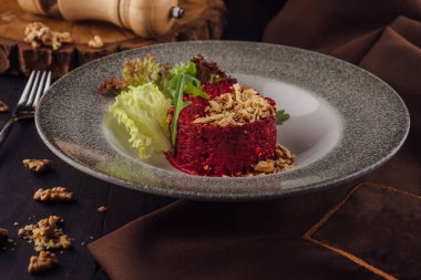 Warm beetroot, nuts and herbs salad