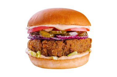 cheeseburger with beef patty, pickles, cheese, tomato, onion, lettuce and ketchup mustard isolated on white background