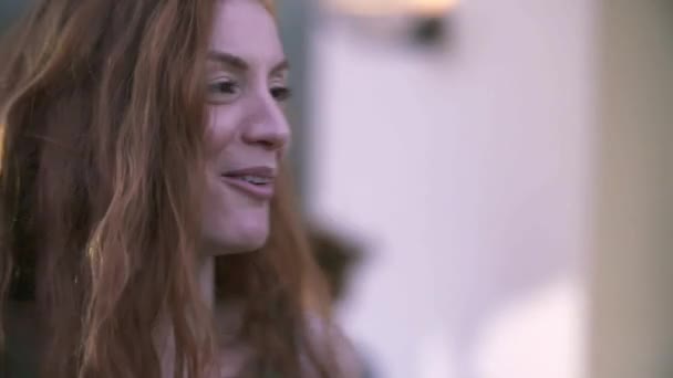 Close up of redhead woman talking, eating and drinking at summer party — Stock Video