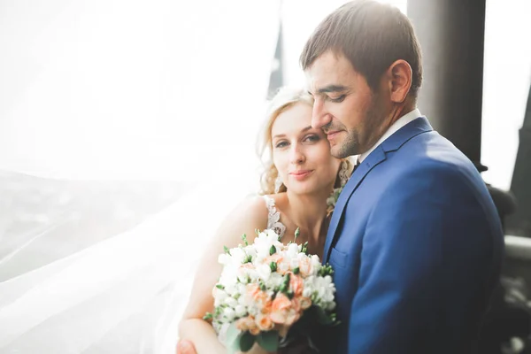 Gorgeous wedding couple walking in the old city of Lviv — Stock Photo, Image