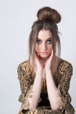 beautiful elegant female wearing African inspired clothing. Close up portrait