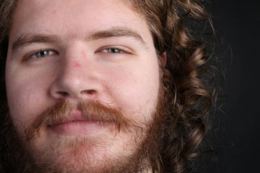 Plus size male with long hair and a beard