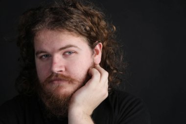 close up portrait of Plus size male with long hair and a beard 