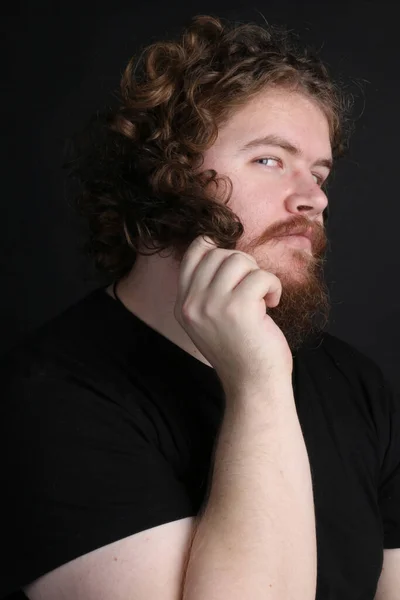 Size Male Long Hair Beard Twirling His Hair While Posing — Stok fotoğraf