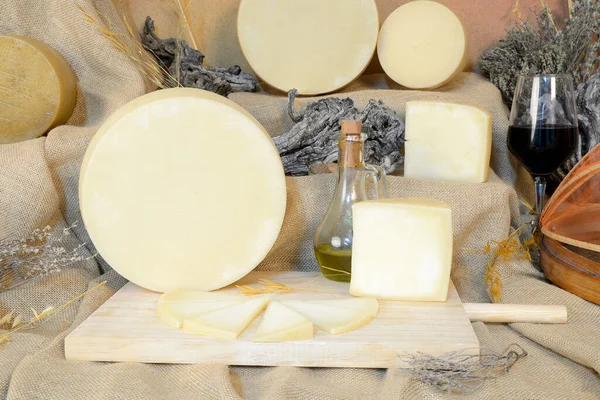 Various Cheeses Next Glass Wine Oil Brown Cloth Background — Fotografia de Stock