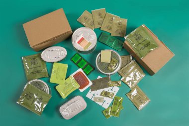 Individual combat rations, Spanish army military food kit, MRE. Products that come in the boxes, food and other accessories such as water purification and ignition tablets, stove and matches, chewing gum, isotonic powders and toothpaste.