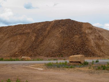 Pile of orange slag rocks stones in Falu Copper Mine World Heritage Sweden