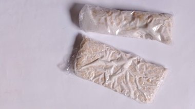 Raw tempeh is made from fermented soybeans, it can be stir-fried and mixed with other dishes