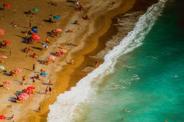Fethiye, Mugla, Turkey - September 2021: Top view of people vacationing at Kabakkoyu beach, Selective Focus