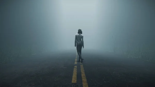 暗い背景の霧に包まれた道に立つ女性のシルエット ストック写真