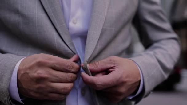 Man Buttons Button His Jacket His Hands — Vídeo de Stock