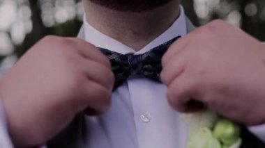 man with black bow tie in suit