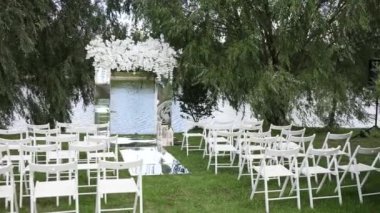 Beautiful wedding arch for the ceremony near the lake
