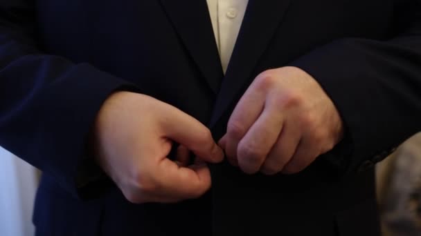 Man Buttoning His Jacket His Hands — Stock Video