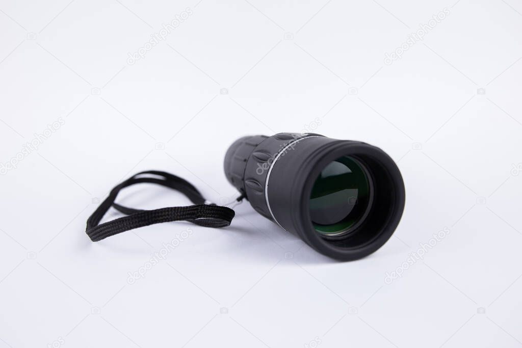 a black monocular for observation on a white background