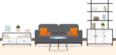 Yuvarlak masalı şık bir kanepe ve ofis içi kitap rafları.