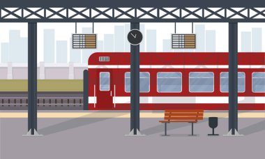 Şehirdeki tren istasyonunda kırmızı bir yolcu treni.