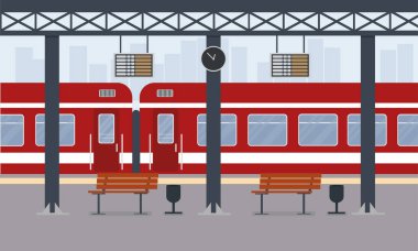 Şehirdeki tren istasyonunda kırmızı bir yolcu treni.
