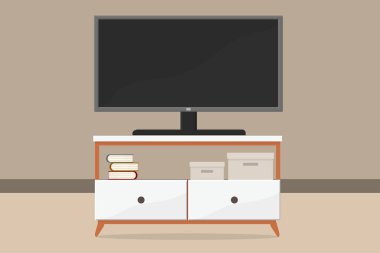 Odada geniş bir çekmecede büyük bir televizyon var.