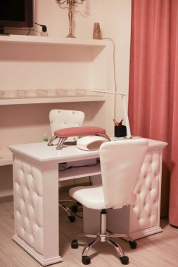 a workplace of the master for manicure chair table and devices nails