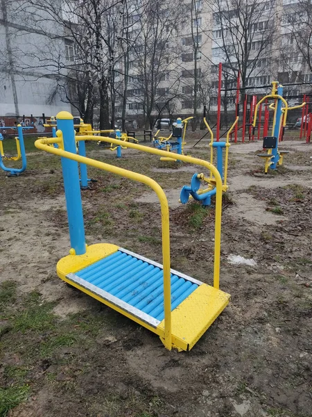 an exercise equipment for sports on the street near the houses
