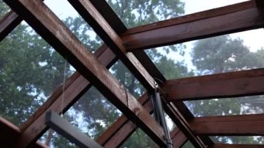 roof in a house made of glass and wood modern