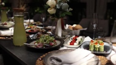 a salads and snacks on the festive table in the restaurant at the wedding