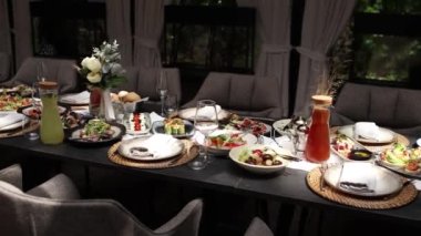 a salads and snacks on the festive table in the restaurant at the wedding