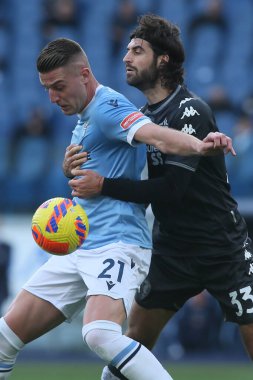ROME, Italy - 06.01.2022: MILINKOVIC SAVIC (LAZIO), S.LUPERTO (EMP) in action during the Italian Serie A football match between SS LAZIO VS EMPOLI at Olympic stadium in Rome