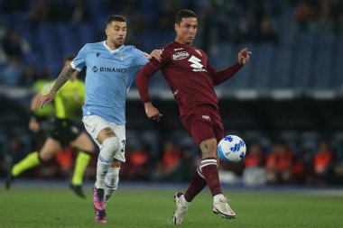 ROME, İtalya - 16.04.2022: ZACCAGNI (LAZIO), IZO ANTONIO (TOR) İtalyan Serisi sırasında SS LAZIO - TORINO FC arasında Roma Olimpiyat Stadyumu 'nda oynanan futbol karşılaşması sırasında